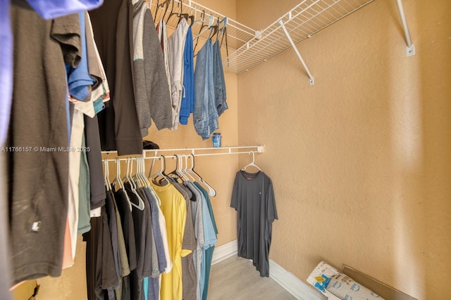 spacious closet with wood finished floors