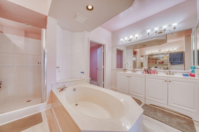 full bathroom with a sink, a bath, a stall shower, double vanity, and visible vents