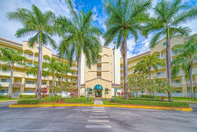 view of property featuring uncovered parking