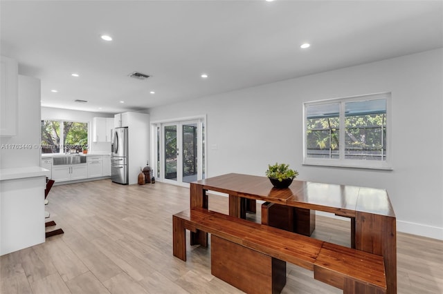 dining area featuring visible vents, baseboards, recessed lighting, and light wood-style floors