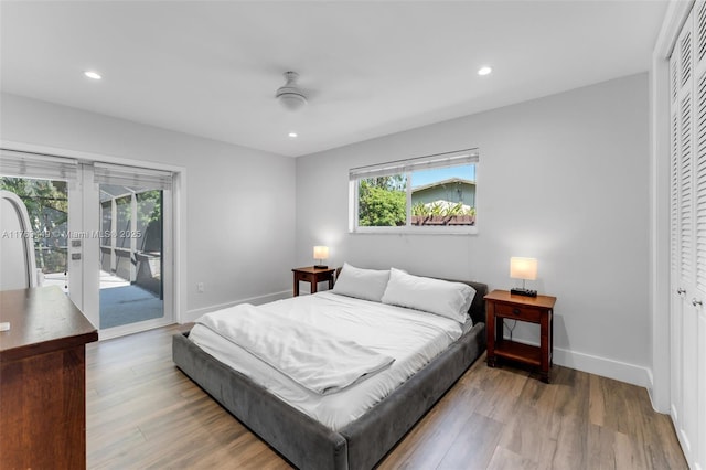 bedroom featuring recessed lighting, access to outside, baseboards, and wood finished floors