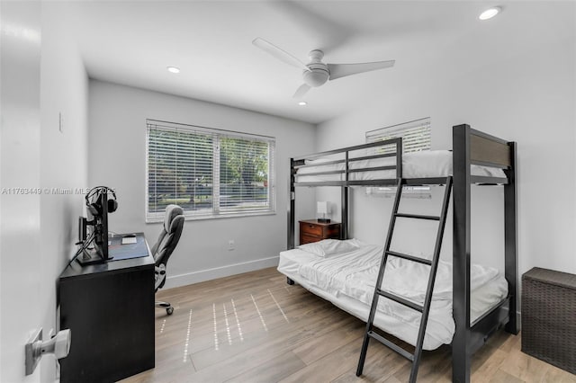 bedroom featuring wood finished floors, baseboards, a ceiling fan, and recessed lighting