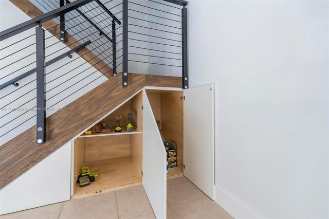 stairs with tile patterned flooring