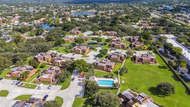 drone / aerial view featuring a water view and a residential view