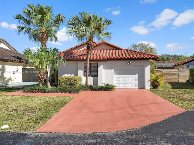 13481 SW 103rd St, Miami, FL 33186 - mediterranean / spanish-style home featuring fence, concrete driveway, a tiled roof, stucco siding, and a garage