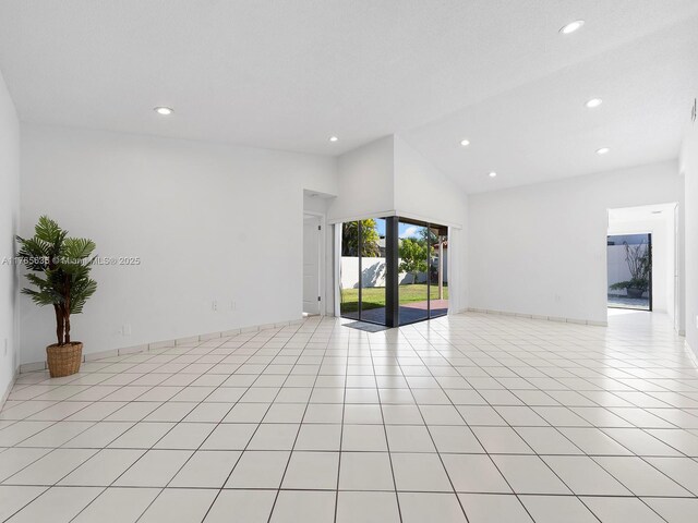 13481 SW 103rd St, Miami, FL 33186 - unfurnished room featuring light tile patterned flooring, recessed lighting, and high vaulted ceiling