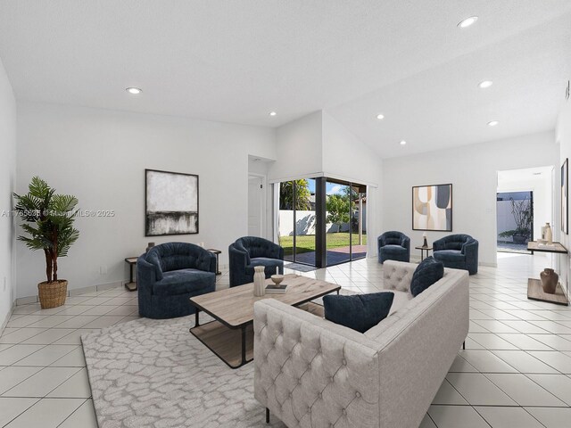 13481 SW 103rd St, Miami, FL 33186 - living room with light tile patterned floors, recessed lighting, and high vaulted ceiling