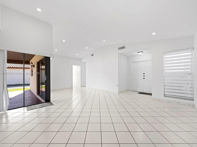 13481 SW 103rd St, Miami, FL 33186 - unfurnished living room with visible vents, lofted ceiling, and recessed lighting