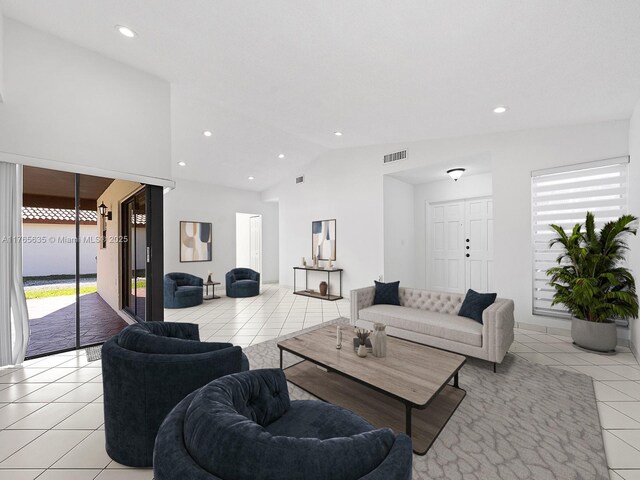 13481 SW 103rd St, Miami, FL 33186 - living area with lofted ceiling, light tile patterned floors, visible vents, and recessed lighting