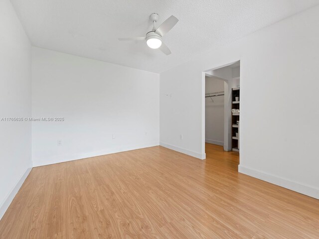 13481 SW 103rd St, Miami, FL 33186 - spare room featuring baseboards, light wood-type flooring, and a ceiling fan