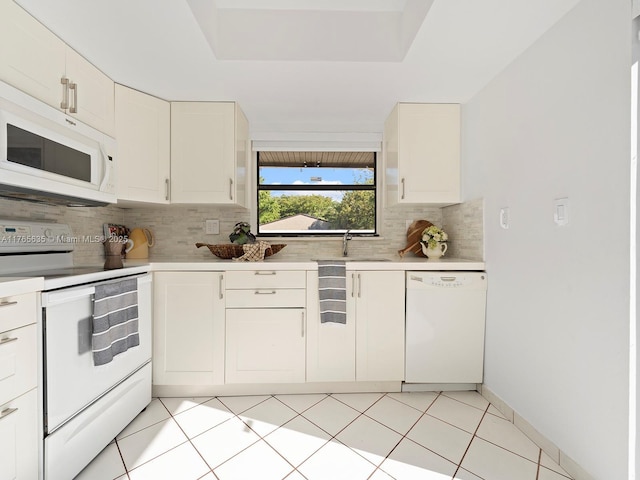 13481 SW 103rd St, Miami, FL 33186 - kitchen with tasteful backsplash, white appliances, white cabinets, and light countertops