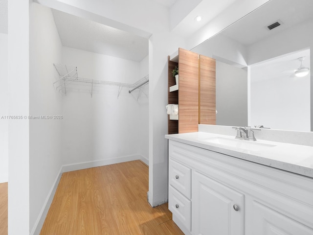 13481 SW 103rd St, Miami, FL 33186 - bathroom featuring vanity, visible vents, wood finished floors, and baseboards
