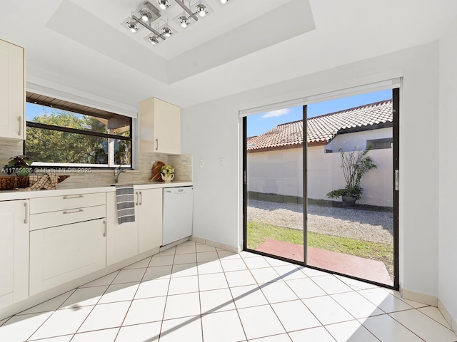 13481 SW 103rd St, Miami, FL 33186 - kitchen with tasteful backsplash, plenty of natural light, a tray ceiling, and white dishwasher