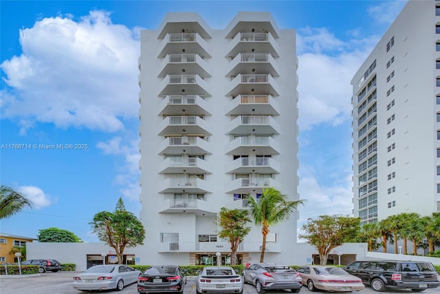 view of property with uncovered parking