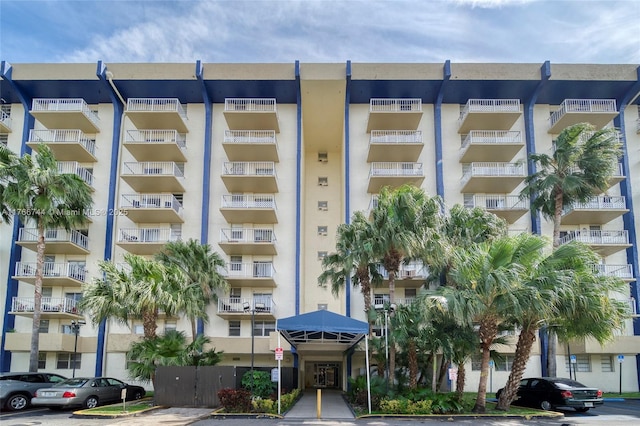 view of property featuring uncovered parking