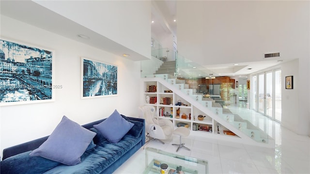 living area featuring recessed lighting, stairs, visible vents, and tile patterned flooring
