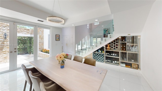 tiled dining room featuring stairway, visible vents, french doors, and recessed lighting