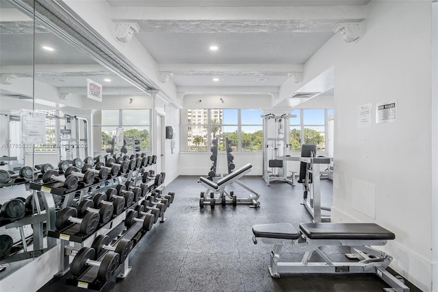 exercise room with baseboards and visible vents