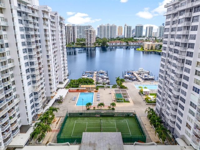 bird's eye view featuring a water view and a city view