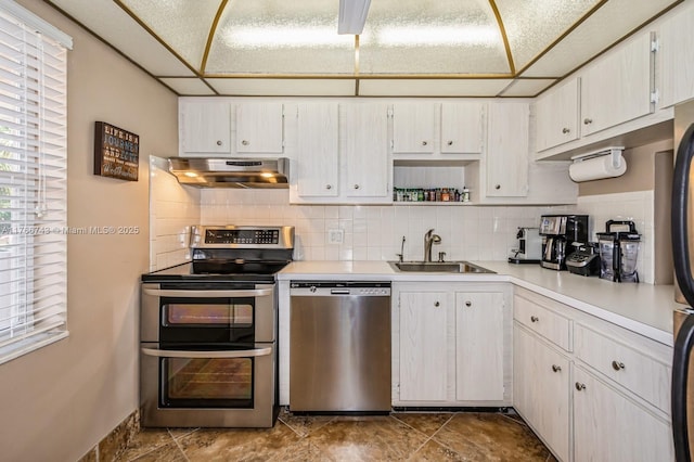 1045 Country Club Dr Unit 304, Margate, FL 33063 - kitchen featuring a sink, light countertops, under cabinet range hood, appliances with stainless steel finishes, and backsplash