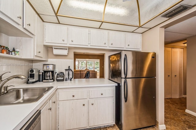 1045 Country Club Dr Unit 304, Margate, FL 33063 - kitchen featuring visible vents, a sink, freestanding refrigerator, white cabinets, and light countertops