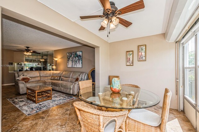 1045 Country Club Dr Unit 304, Margate, FL 33063 - dining space featuring a textured ceiling and ceiling fan