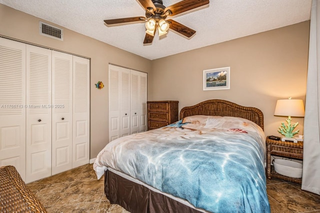 1045 Country Club Dr Unit 304, Margate, FL 33063 - bedroom featuring visible vents, ceiling fan, a textured ceiling, and multiple closets