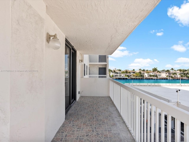 balcony featuring a water view