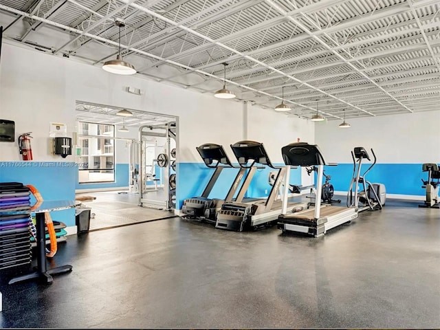 exercise room with baseboards