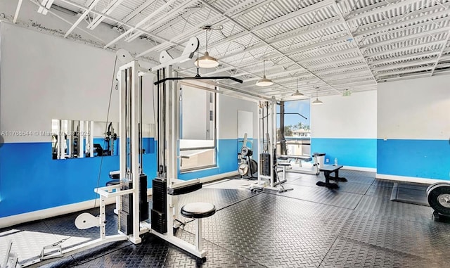 workout area featuring baseboards