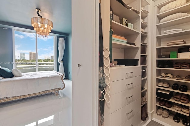 1150 102nd St Unit 501, Bay Harbor Islands, FL 33154 - spacious closet featuring a chandelier