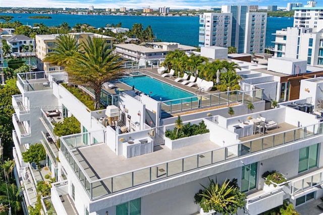 1150 102nd St Unit 501, Bay Harbor Islands, FL 33154 - view of urban area with a pool and a large body of water