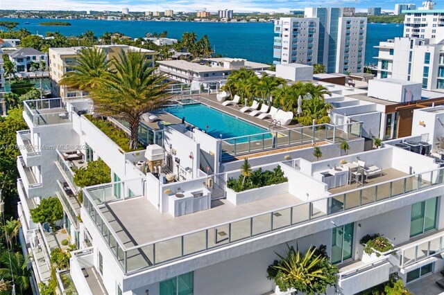 1150 102nd St Unit 501, Bay Harbor Islands, FL 33154 - view of urban area with a pool and a large body of water