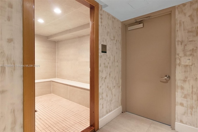 1150 102nd St Unit 501, Bay Harbor Islands, FL 33154 - bathroom with wallpapered walls, elevator, and tile patterned floors