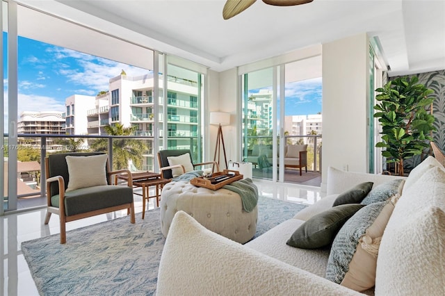 1150 102nd St Unit 501, Bay Harbor Islands, FL 33154 - living area featuring a ceiling fan and floor to ceiling windows