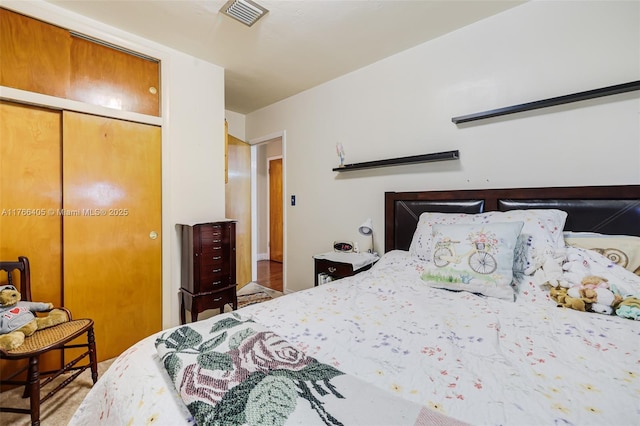bedroom with visible vents and a closet