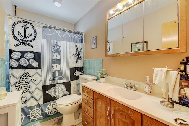 full bathroom featuring toilet, curtained shower, tile walls, and vanity