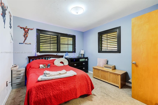 carpeted bedroom with baseboards
