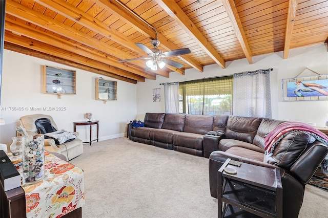 living room featuring beamed ceiling, wooden ceiling, a ceiling fan, and carpet floors