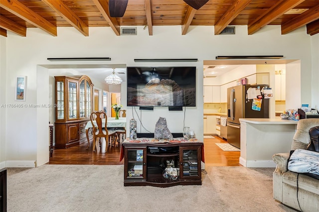 living room with wooden ceiling, beamed ceiling, carpet, and visible vents
