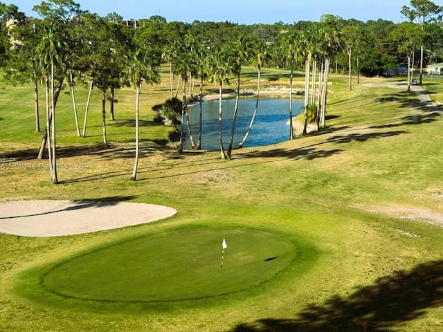 3836 Via Poinciana Unit 604, Lake Worth, FL 33467 - view of home's community featuring a water view, a putting green, golf course view, and view of wooded area