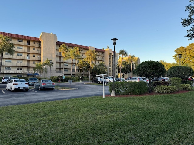 3836 Via Poinciana Unit 604, Lake Worth, FL 33467 - view of property with uncovered parking