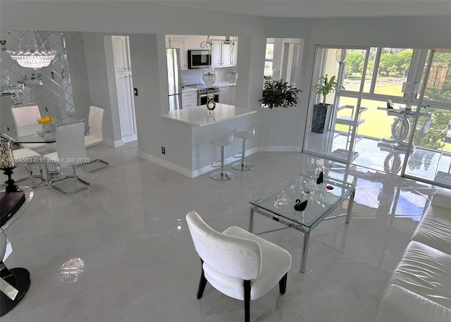 3836 Via Poinciana Unit 604, Lake Worth, FL 33467 - living room with baseboards and light marble finish floors