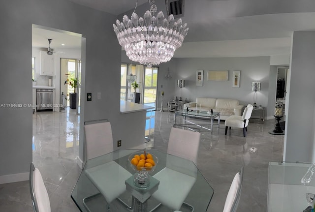 dining area with baseboards, marble finish floor, visible vents, and ceiling fan with notable chandelier