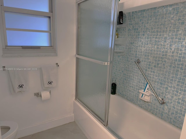 3836 Via Poinciana Unit 604, Lake Worth, FL 33467 - bathroom with baseboards, toilet, and enclosed tub / shower combo