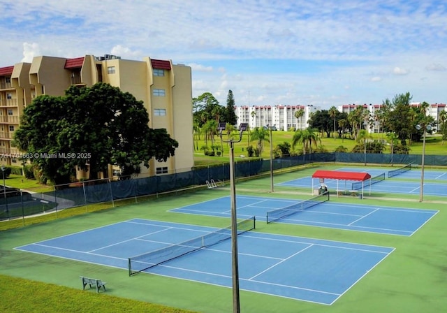 view of tennis court with fence