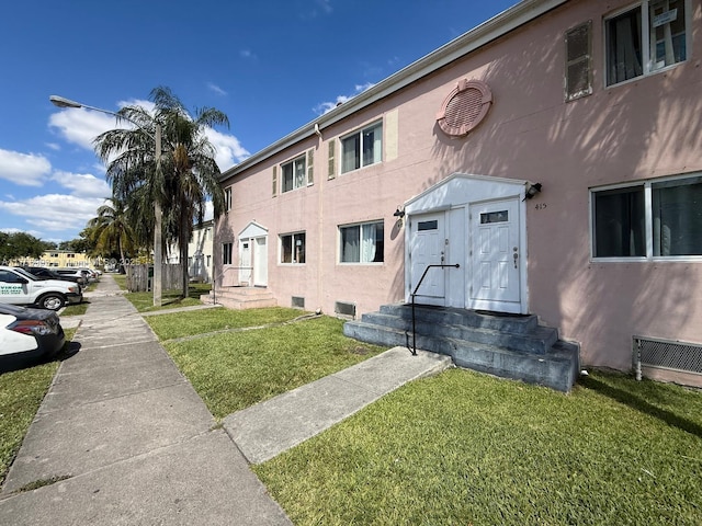 417 NW 84th St Unit 417, Miami, FL 33150 - exterior space featuring a front yard and stucco siding