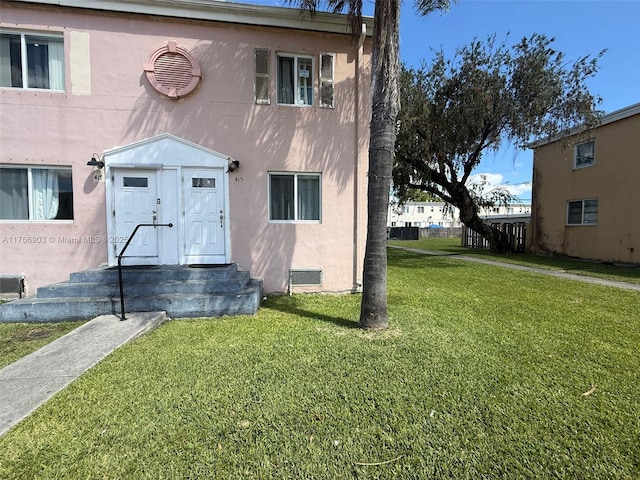 417 NW 84th St Unit 417, Miami, FL 33150 - view of front of property featuring stucco siding and a front lawn