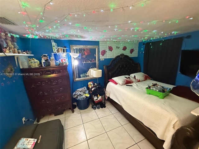 417 NW 84th St Unit 417, Miami, FL 33150 - bedroom featuring tile patterned flooring, track lighting, and visible vents