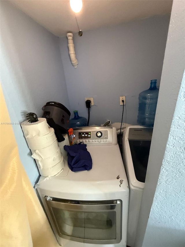 417 NW 84th St Unit 417, Miami, FL 33150 - clothes washing area with separate washer and dryer and laundry area